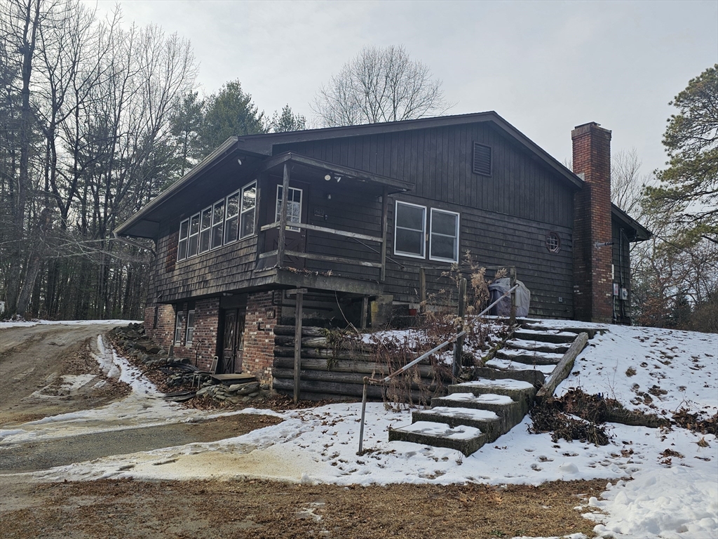 127 Summer Street Thorndike, MA 01079 - Photo 4 of 27 a backyard of a house with wooden fence and large trees