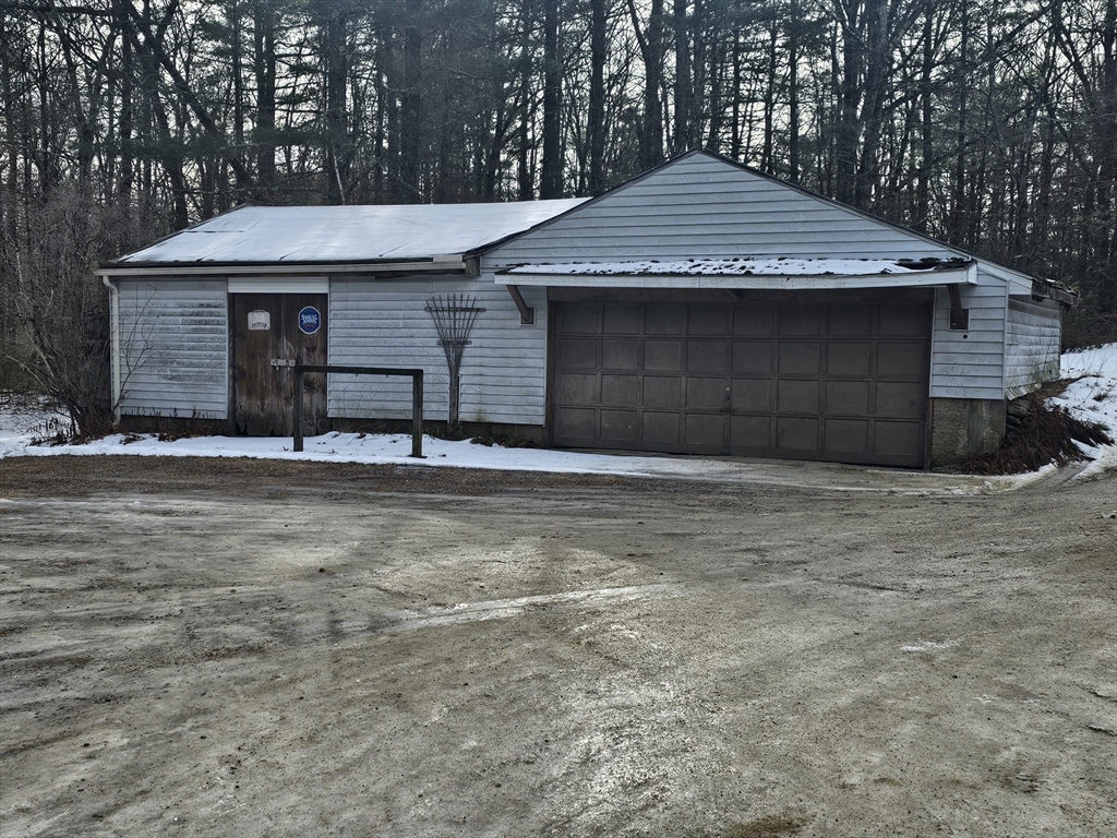 127 Summer Street Thorndike, MA 01079 - Photo 7 of 27 a front view of a house with a garage