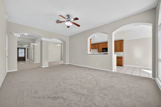 a kitchen with stainless steel appliances granite countertop a sink stove and microwave