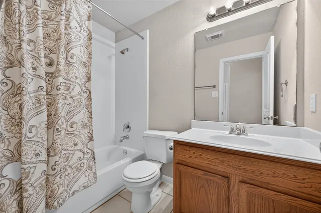 a view of swimming pool with wooden fence