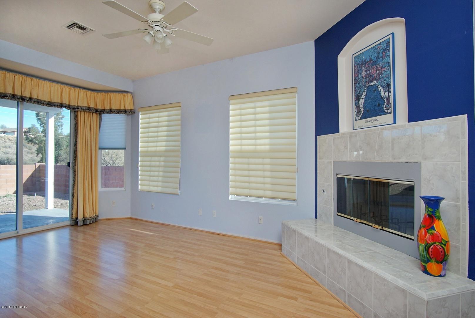 1137 Avenida Seville Rio Rico, AZ 85648 - Photo 4 of 19 a view of livingroom with furniture wooden floor fireplace and windows
