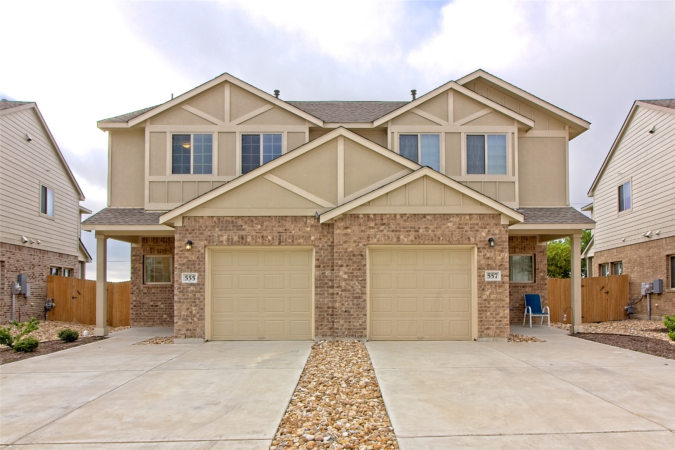 555 White Steppe Way Georgetown, TX 78626 - Photo 1 of 40 Craftsman-style house with roof with shingles, driveway, a gate, and brick siding