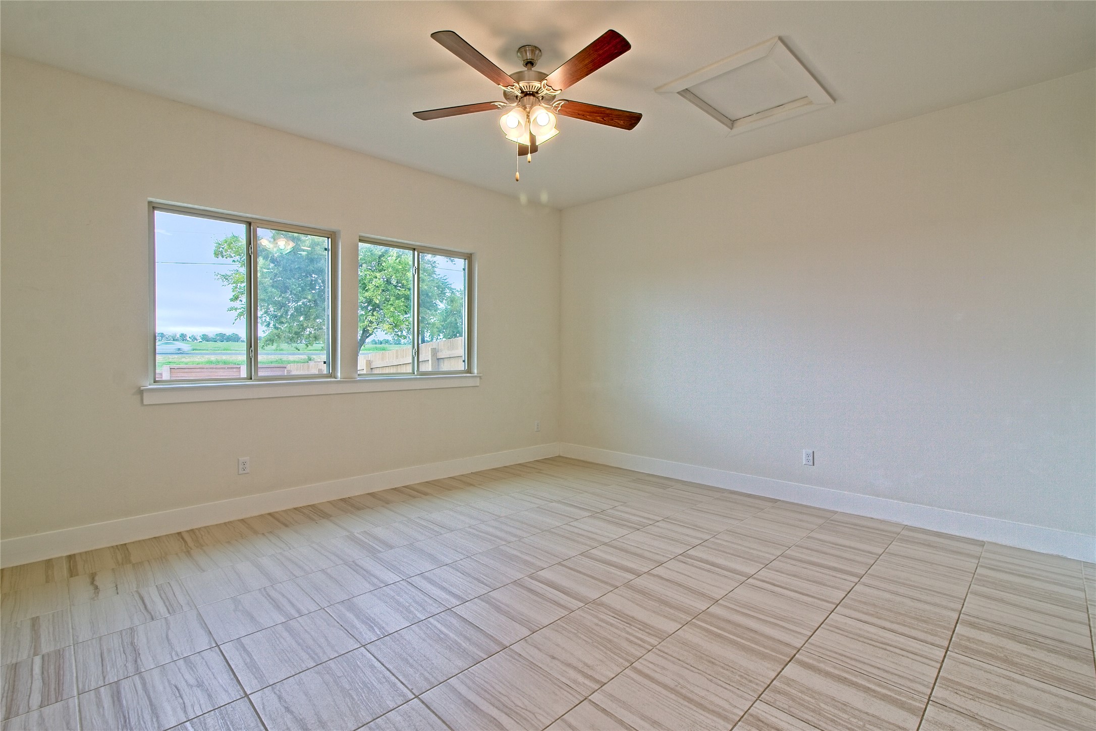 555 White Steppe Way Georgetown, TX 78626 - Photo 13 of 40 Empty room featuring attic access and a ceiling fan