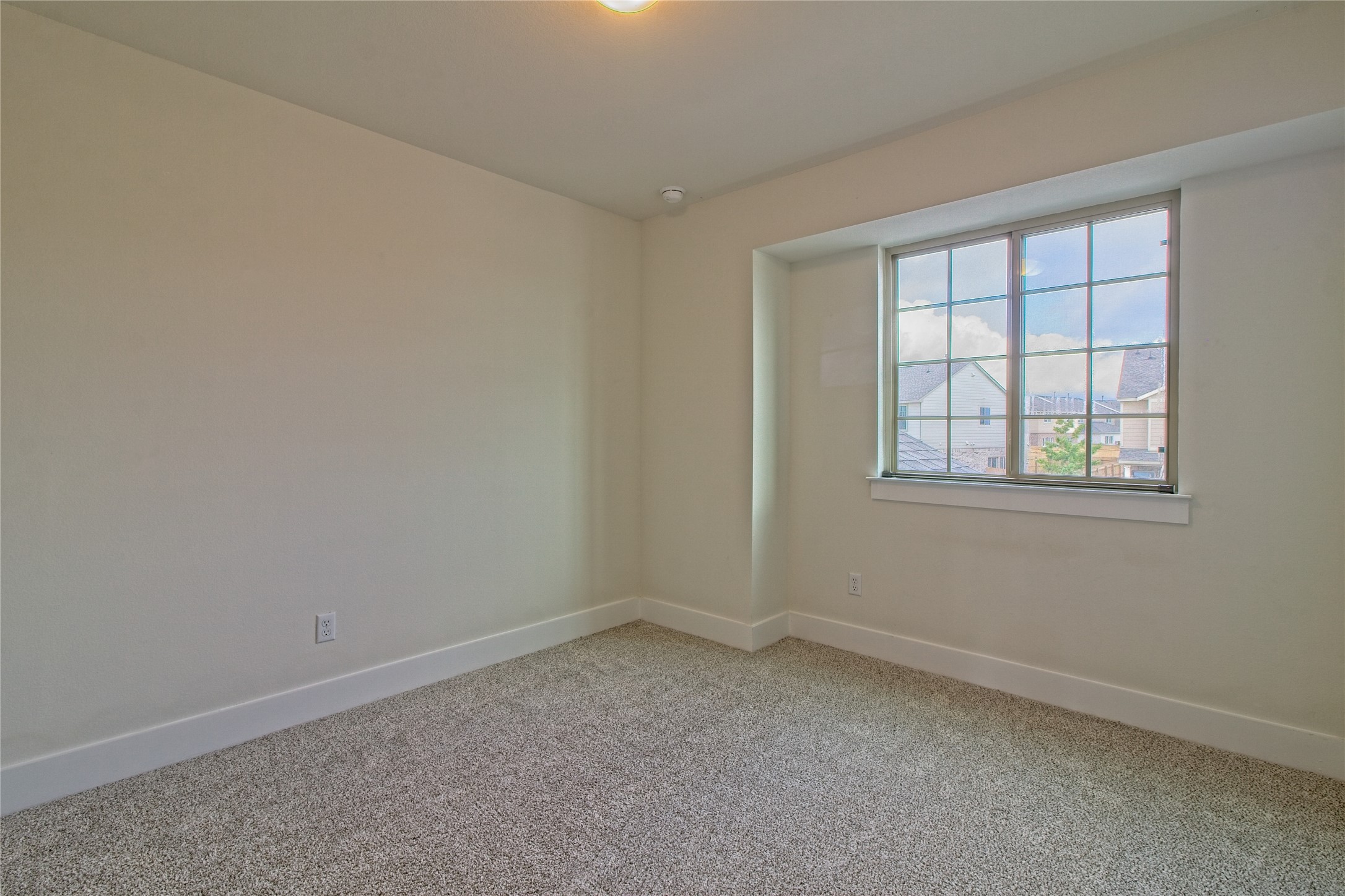 555 White Steppe Way Georgetown, TX 78626 - Photo 24 of 40 Empty room featuring light carpet and baseboards