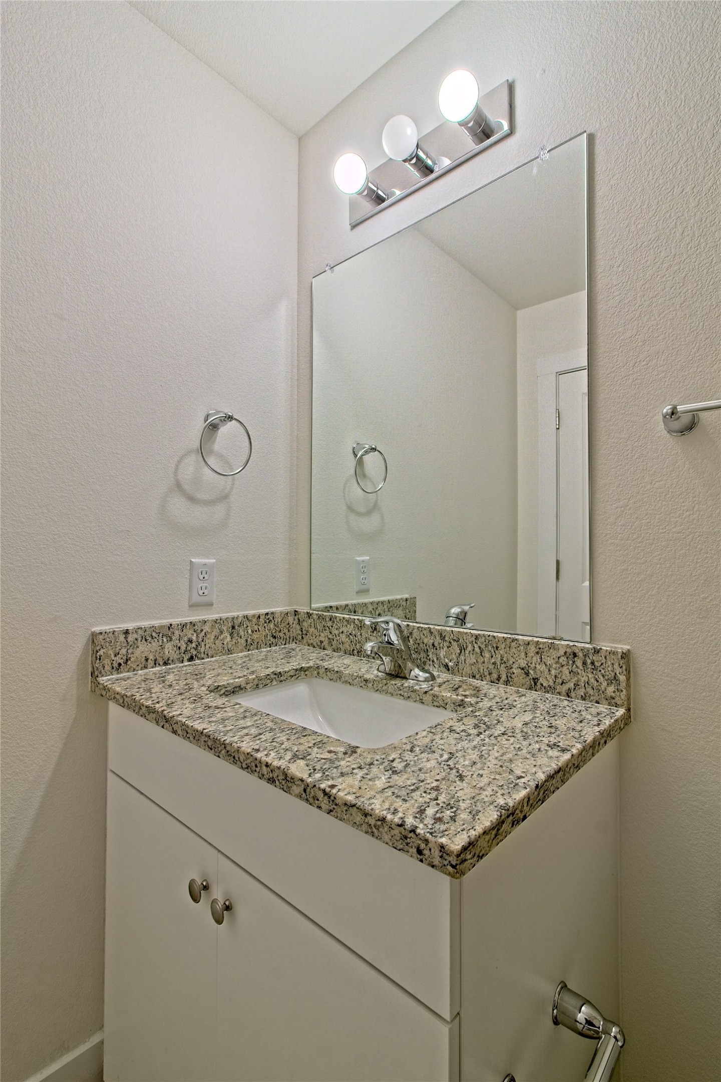 555 White Steppe Way Georgetown, TX 78626 - Photo 25 of 40 Bathroom featuring a textured wall and vanity