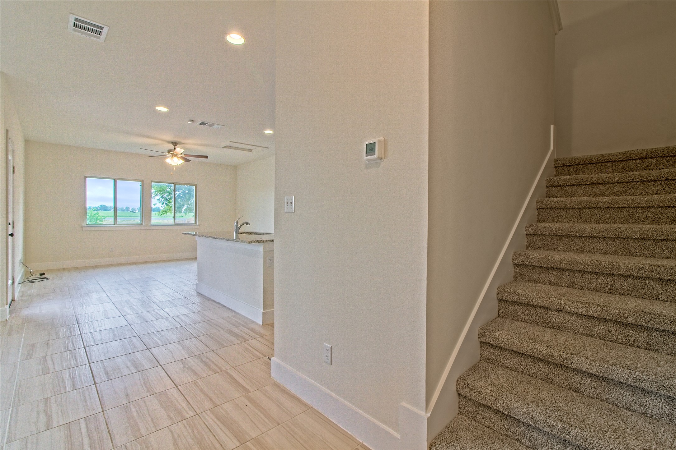 555 White Steppe Way Georgetown, TX 78626 - Photo 6 of 40 Stairway featuring recessed lighting and a ceiling fan