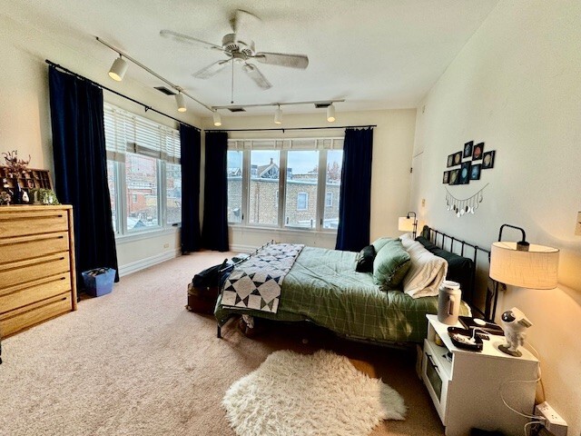 Undisclosed Address Chicago, IL 60614 - Photo 12 of 20 a bedroom with furniture and a large window