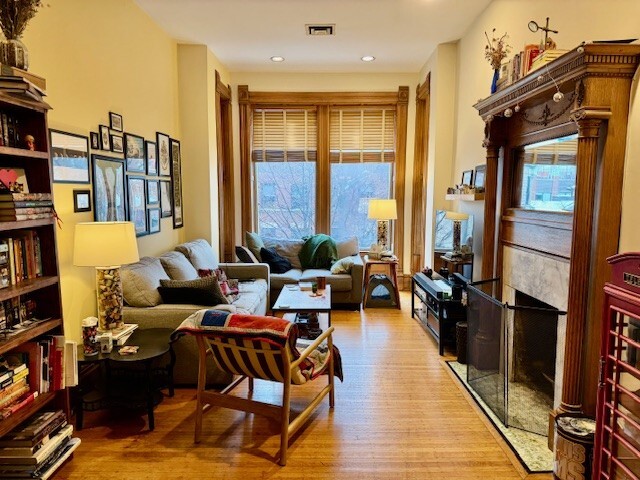 Undisclosed Address Chicago, IL 60614 - Photo 5 of 20 a living room with furniture a large window and wooden floor