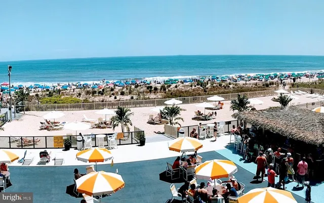 an aerial view of a house with a swimming pool yard and outdoor seating