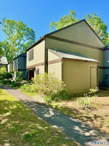 a front view of house along with garden and porch