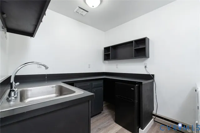 a kitchen with a sink and a microwave