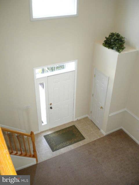 14284 Foxhall Road Dowell, MD 20629 - Photo 7 of 23 a view of a room with wooden floor and cabinet
