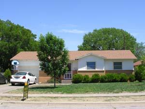 5203 South Travis Street Amarillo, TX 79110 - Photo 1 of 1 a front view of a house with a yard