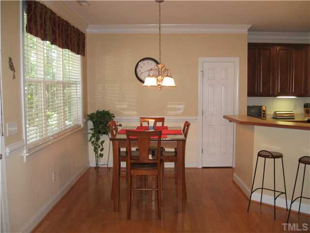 302 East Waycliff Road Henderson, NC 27537 - Photo 5 of 25 Breakfast area....shows pantry and kitchen...more hardwood flooring