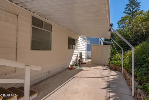 a view of backyard with sitting area