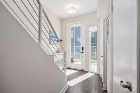 a view of a room with furniture and a mirror