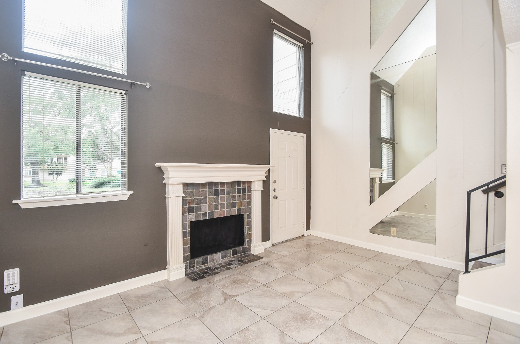 15336 West Little York Road, Unit 208 Houston, TX 77084 - Photo 11 of 33 a view of a livingroom with an empty space and a fireplace