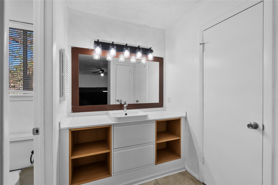 15336 West Little York Road, Unit 208 Houston, TX 77084 - Photo 13 of 33 a bathroom with a double vanity sink and a mirror