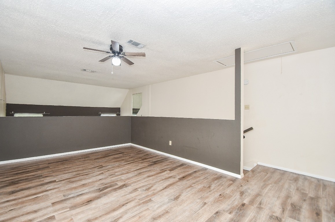 15336 West Little York Road, Unit 208 Houston, TX 77084 - Photo 15 of 33 a view of an empty room with wooden floor