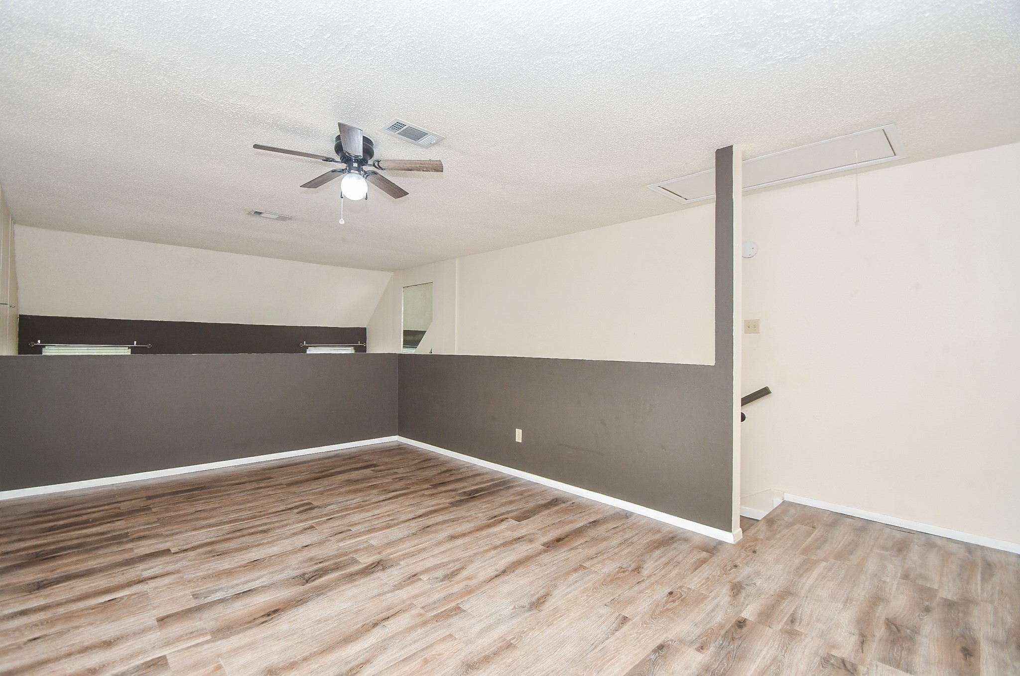 15336 West Little York Road, Unit 208 Houston, TX 77084 - Photo 15 of 33 a view of an empty room with wooden floor