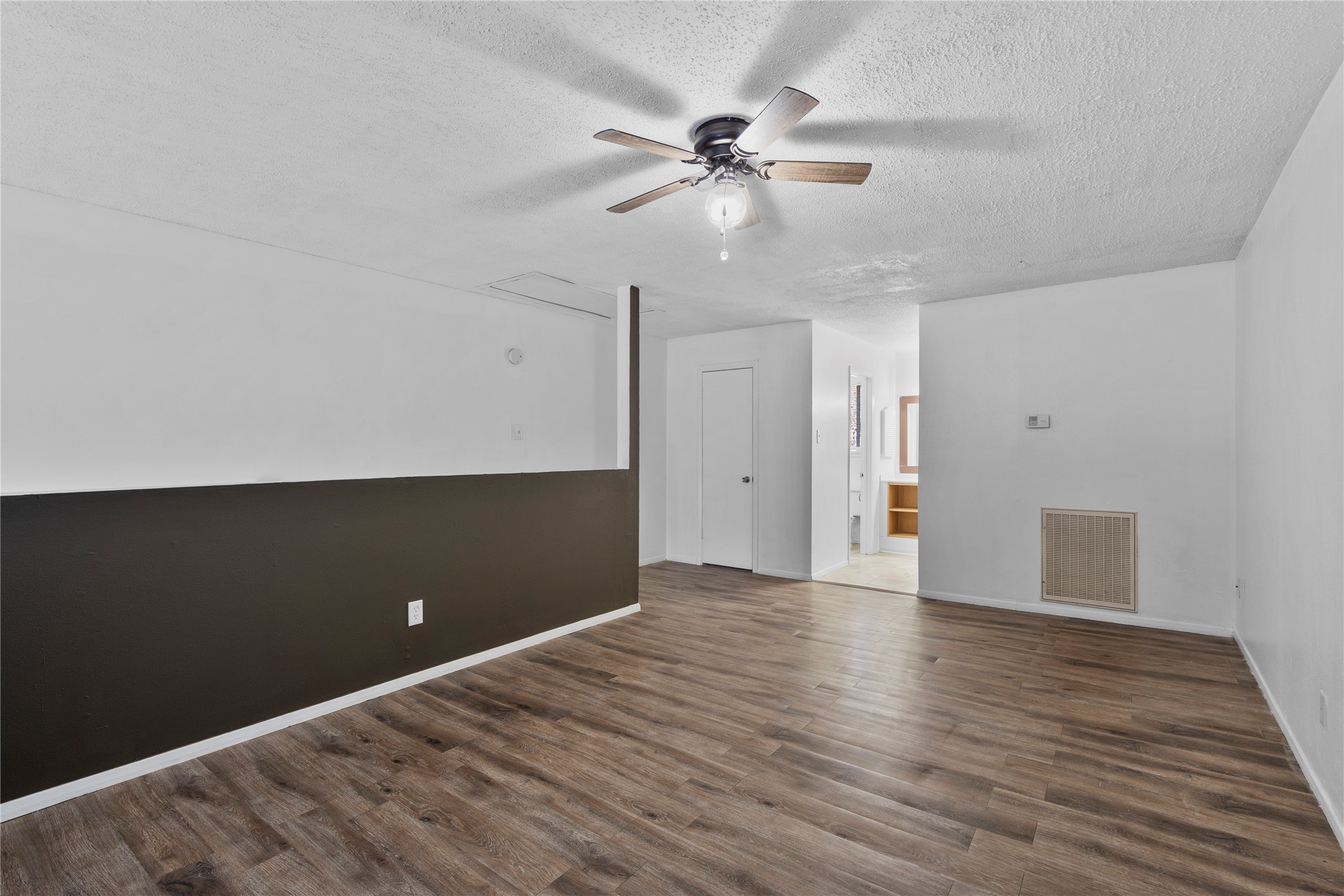 15336 West Little York Road, Unit 208 Houston, TX 77084 - Photo 17 of 33 a view of an empty room with wooden floor