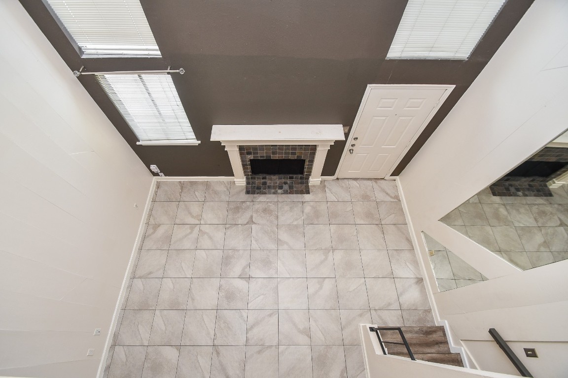 15336 West Little York Road, Unit 208 Houston, TX 77084 - Photo 18 of 33 a view of an empty room with wooden floor and a window