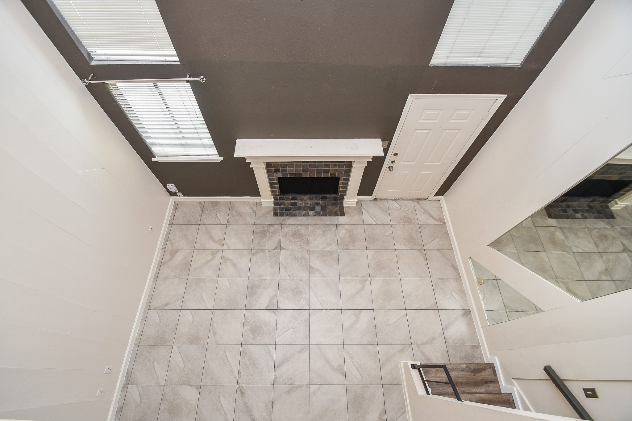 15336 West Little York Road, Unit 208 Houston, TX 77084 - Photo 18 of 33 a view of an empty room with wooden floor and stairs