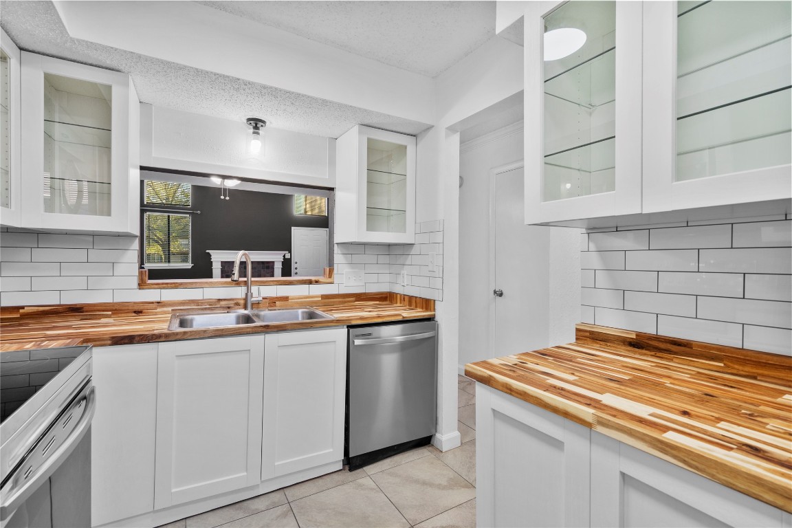 15336 West Little York Road, Unit 208 Houston, TX 77084 - Photo 20 of 33 a kitchen with a sink stove and cabinets