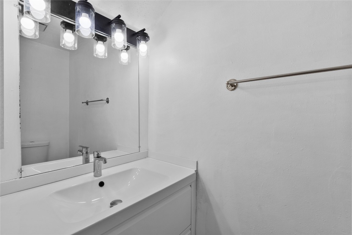15336 West Little York Road, Unit 208 Houston, TX 77084 - Photo 21 of 33 a bathroom with a sink and mirror
