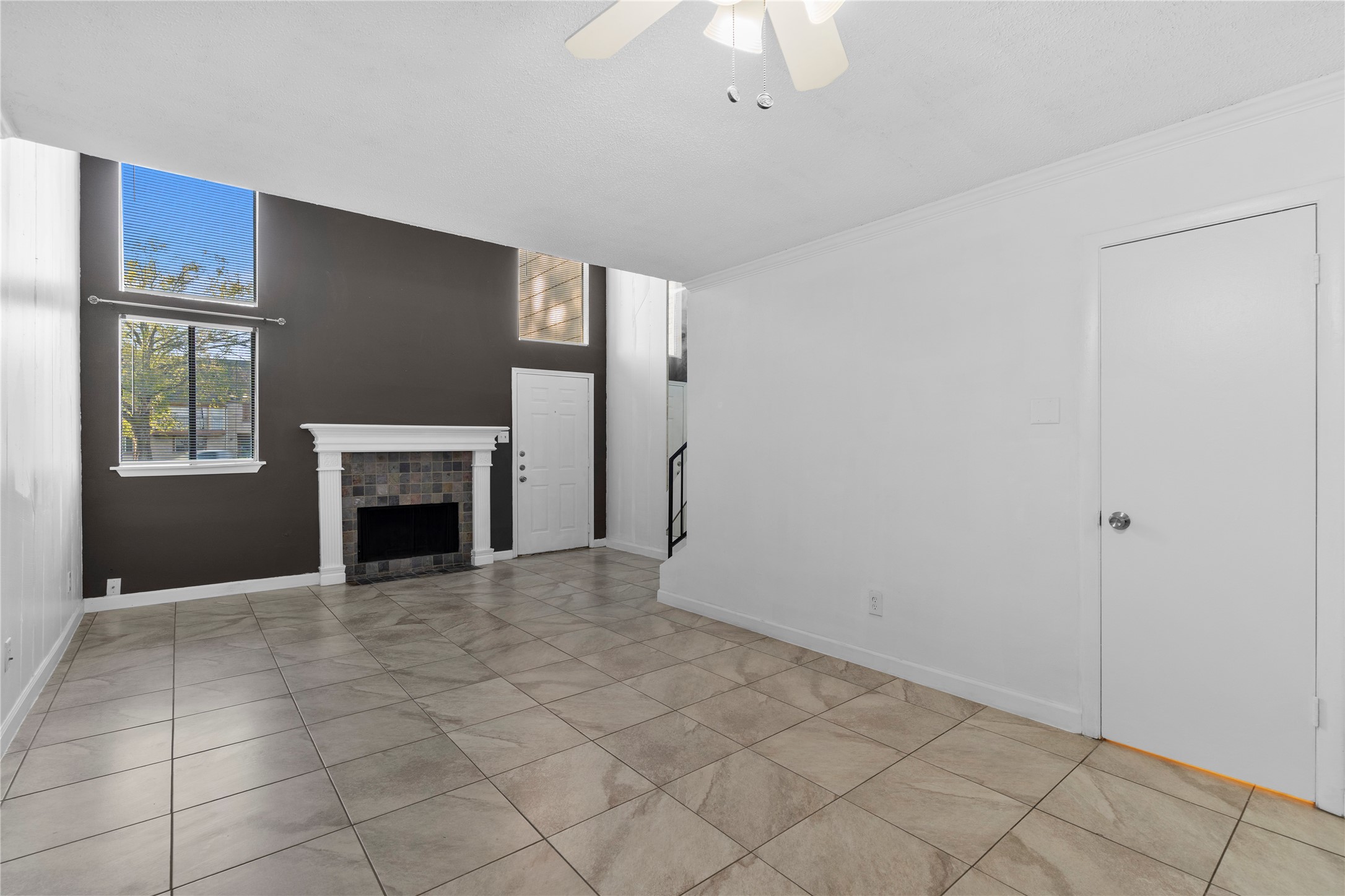 15336 West Little York Road, Unit 208 Houston, TX 77084 - Photo 22 of 33 a view of an empty room with a fireplace and a window
