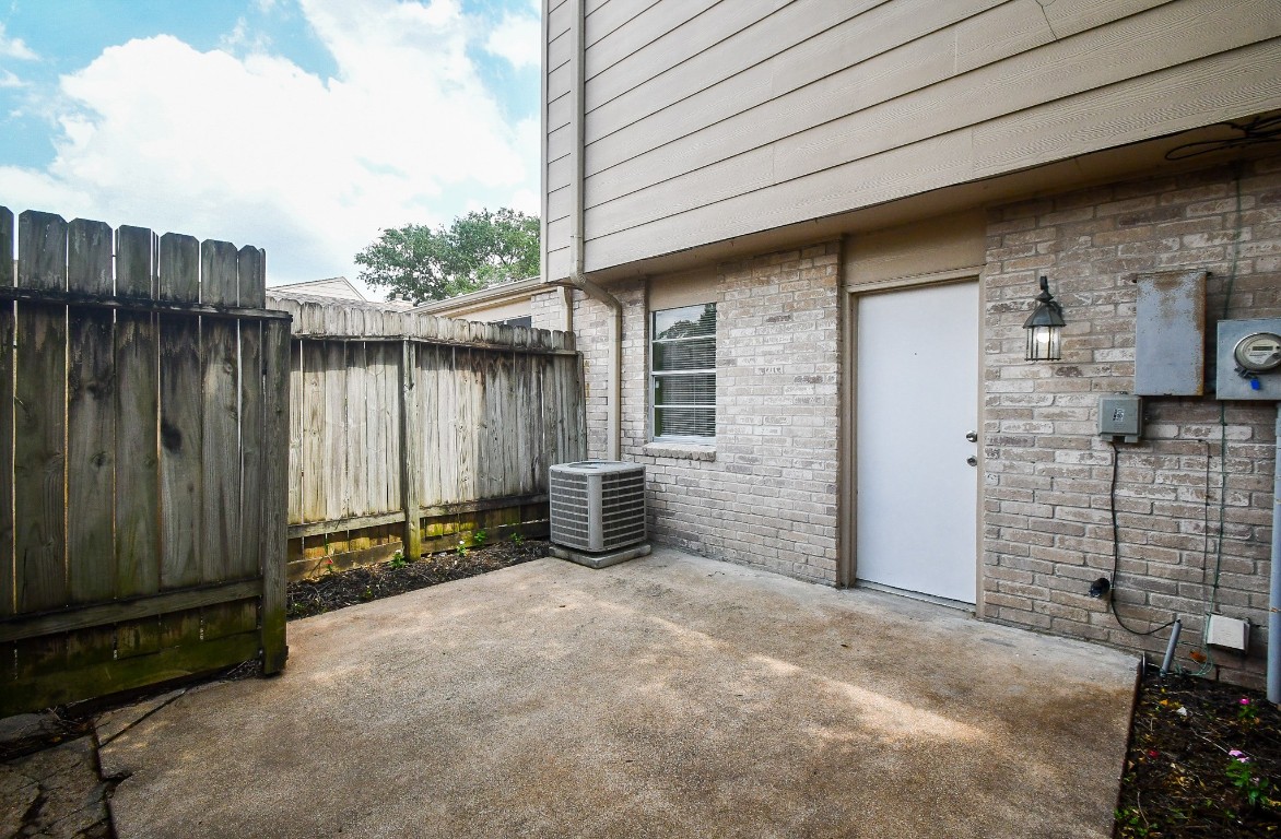 15336 West Little York Road, Unit 208 Houston, TX 77084 - Photo 27 of 33 a view of a house with backyard and wooden fence