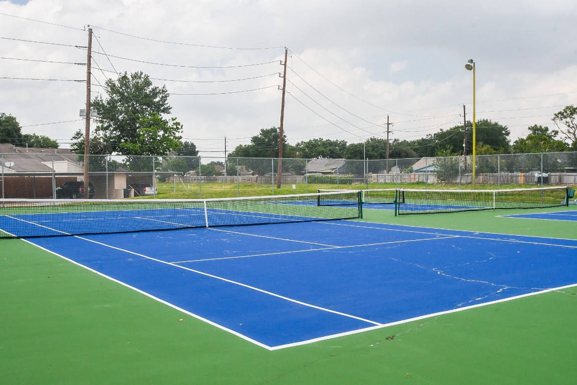 15336 West Little York Road, Unit 208 Houston, TX 77084 - Photo 32 of 33 a view of an outdoor space and tennis court