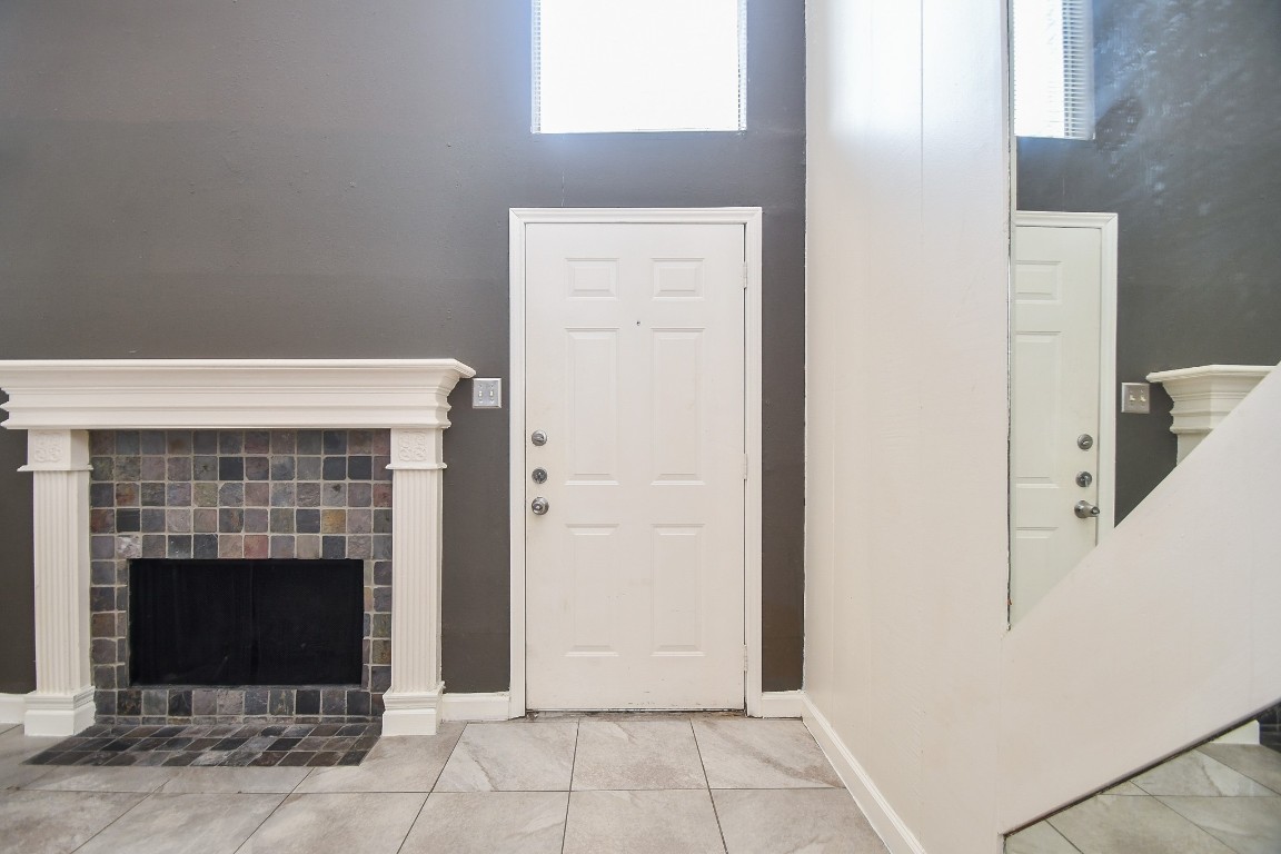 15336 West Little York Road, Unit 208 Houston, TX 77084 - Photo 4 of 33 a view of a livingroom with an empty space and a fireplace