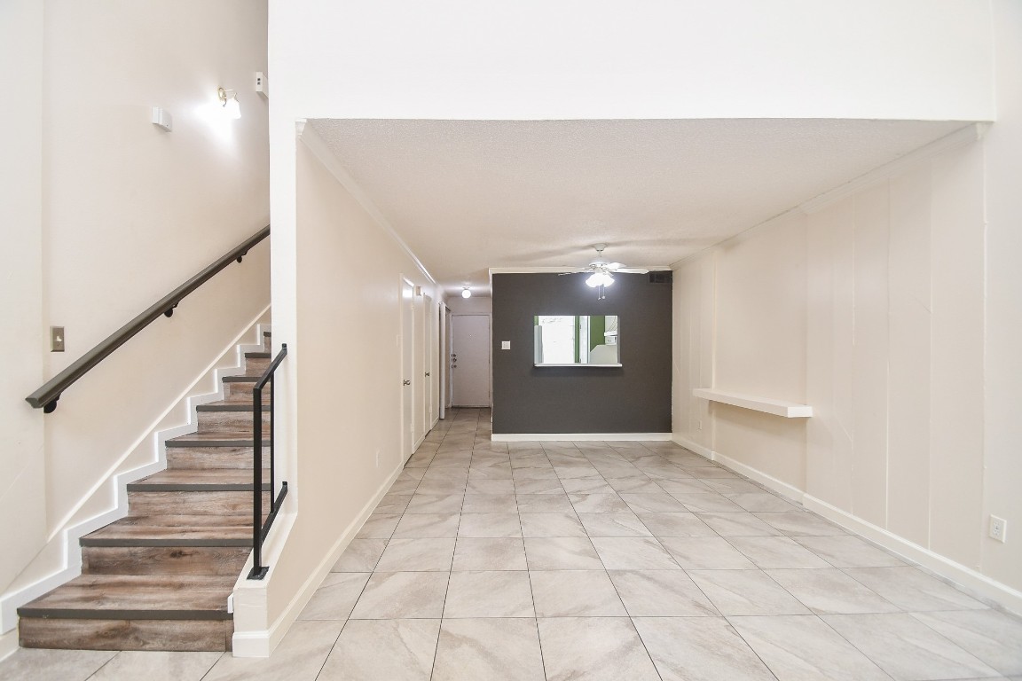 15336 West Little York Road, Unit 208 Houston, TX 77084 - Photo 6 of 33 a view of an empty room and stairs