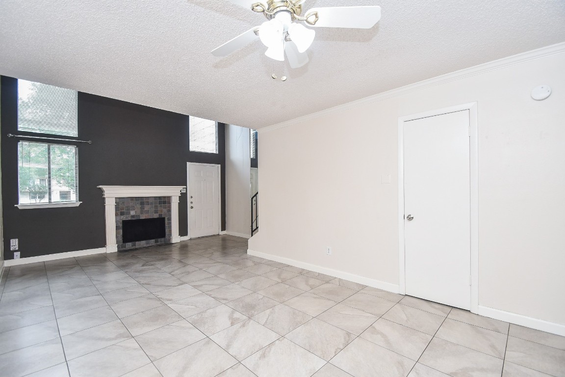 15336 West Little York Road, Unit 208 Houston, TX 77084 - Photo 9 of 33 a view of an empty room with a fireplace