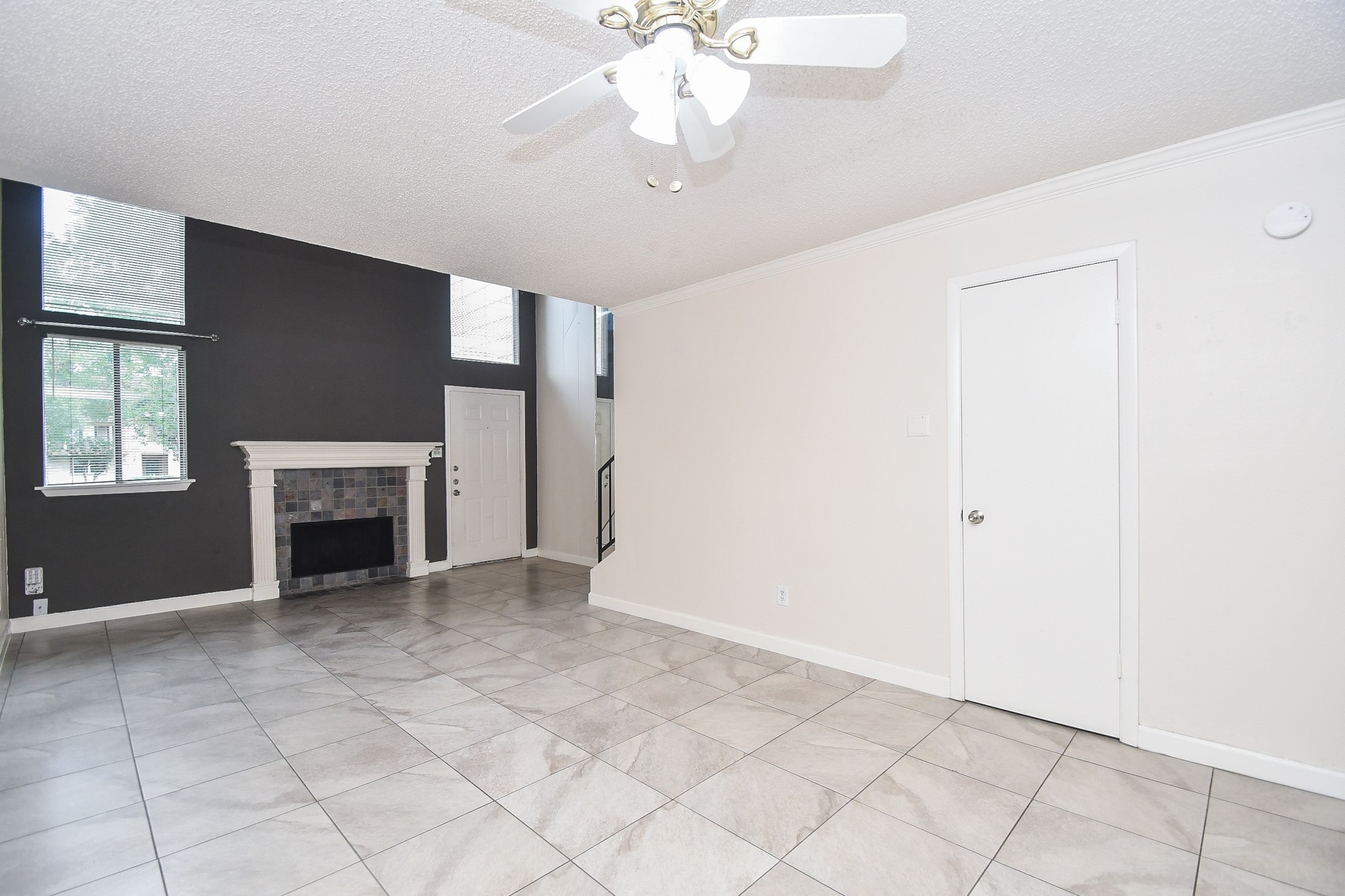 15336 West Little York Road, Unit 208 Houston, TX 77084 - Photo 9 of 33 a view of an empty room with a fireplace