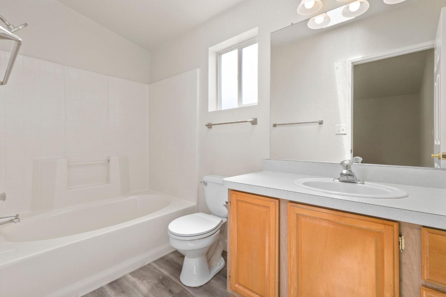 4300 Soquel Drive, Unit 96 Soquel, CA 95073 - Photo 15 of 29 a bathroom with a granite countertop sink toilet and bathtub