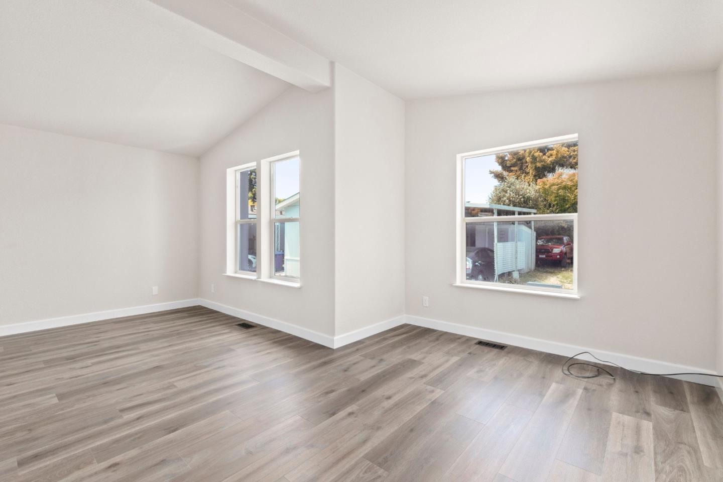 4300 Soquel Drive, Unit 96 Soquel, CA 95073 - Photo 8 of 29 a view of an empty room with wooden floor and a window