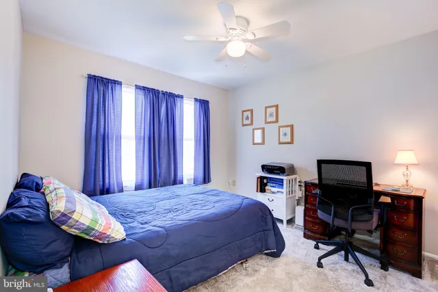 a bedroom with a bed and a tv