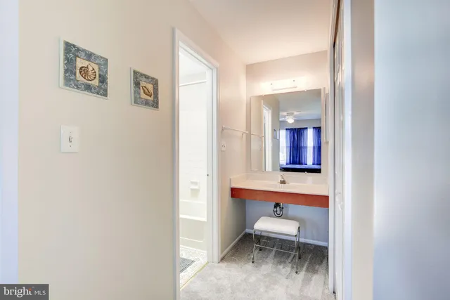 a bathroom with a toilet sink and a mirror