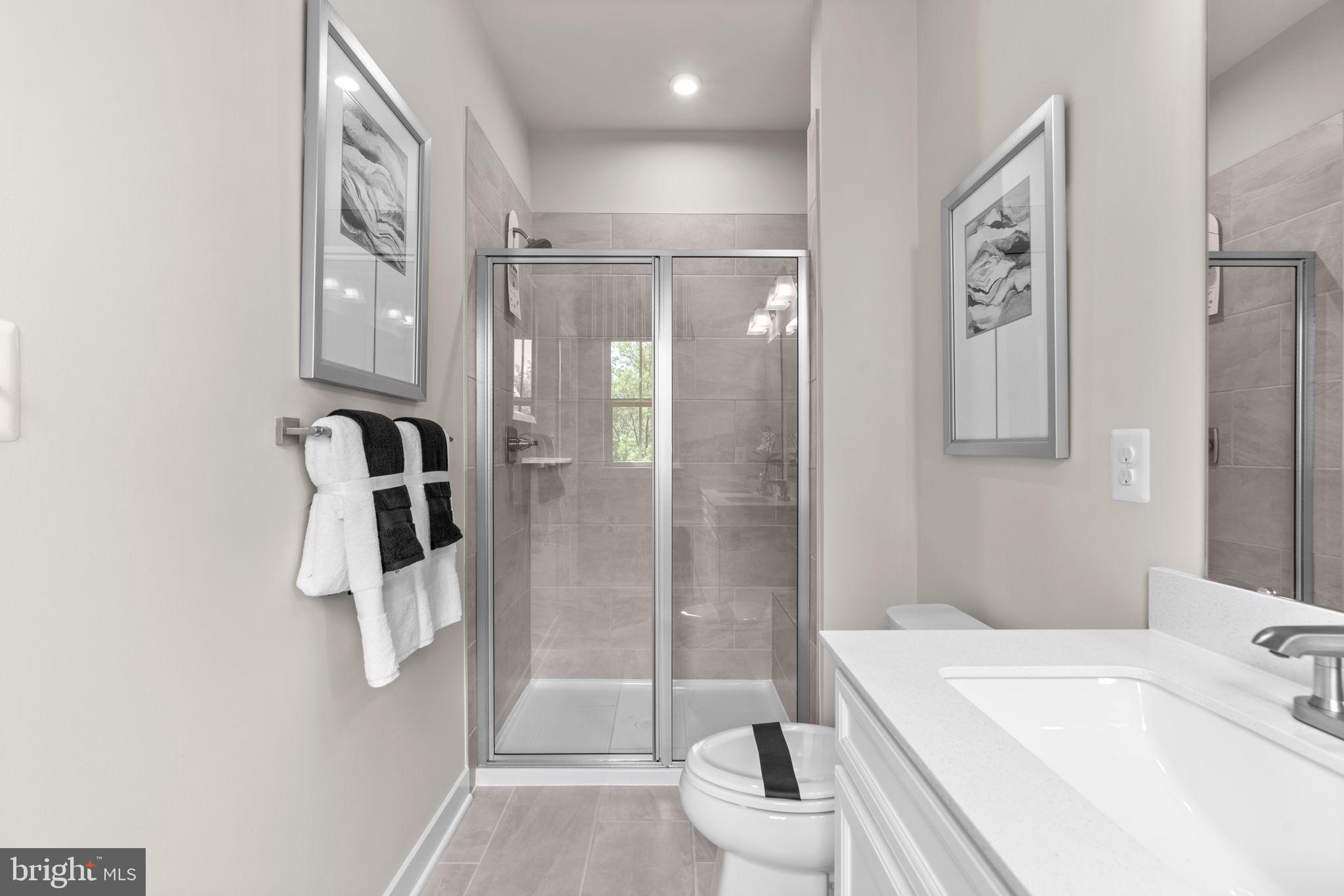 7932 Brandy Station Road Hanover, MD 21076 - Photo 23 of 49 a bathroom with a shower a sink and toilet