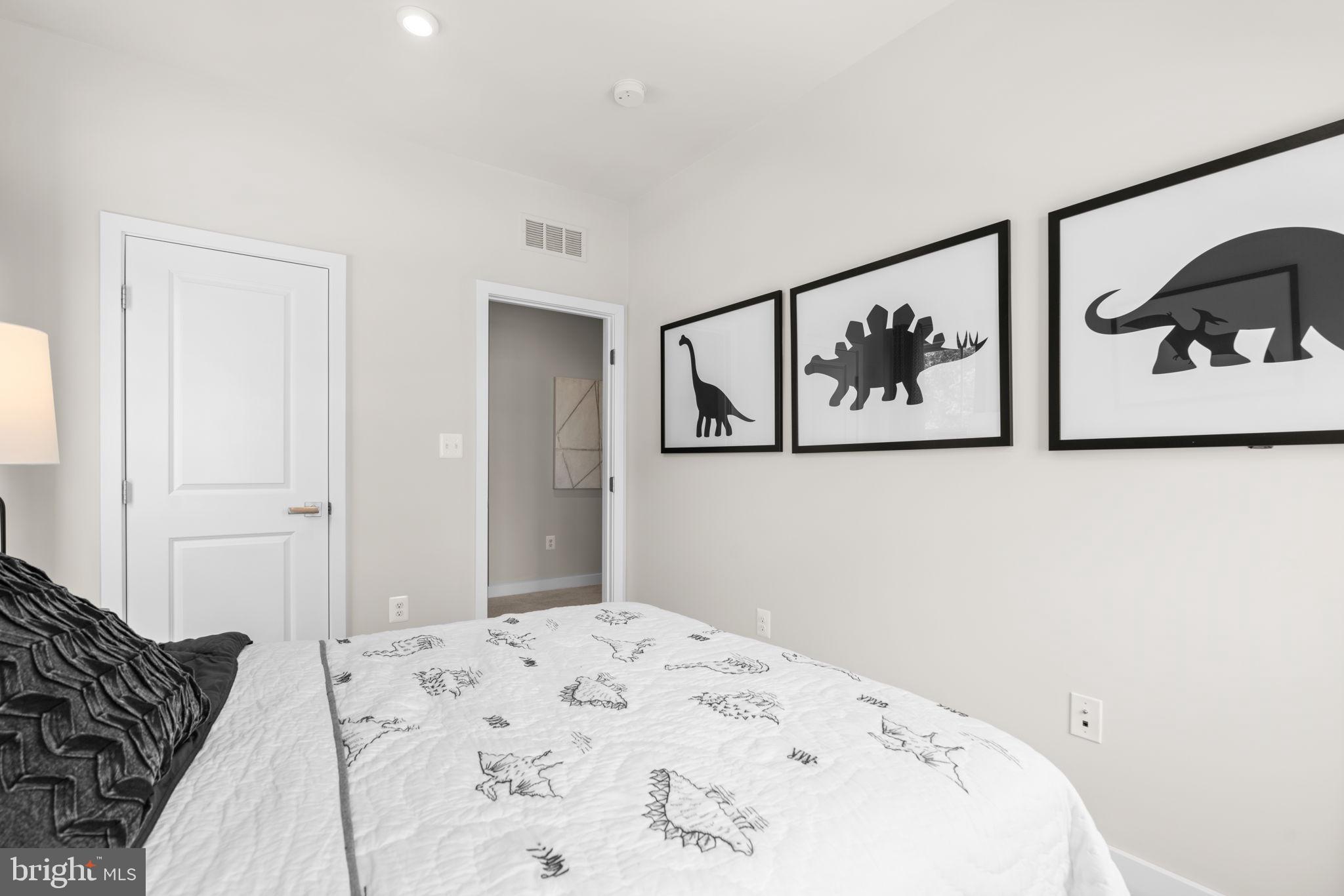7932 Brandy Station Road Hanover, MD 21076 - Photo 30 of 49 a bedroom with a bed and wall painting