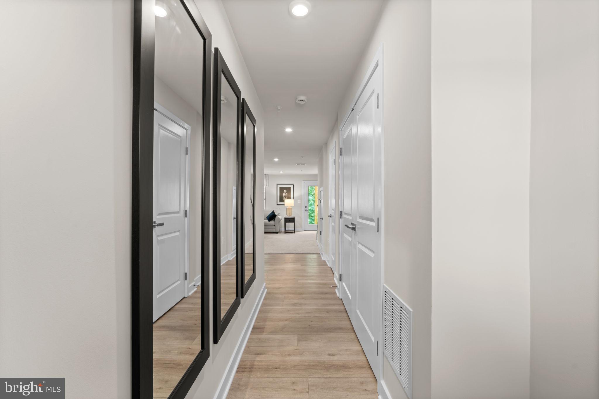 7932 Brandy Station Road Hanover, MD 21076 - Photo 34 of 49 a view of a hallway with wooden floor