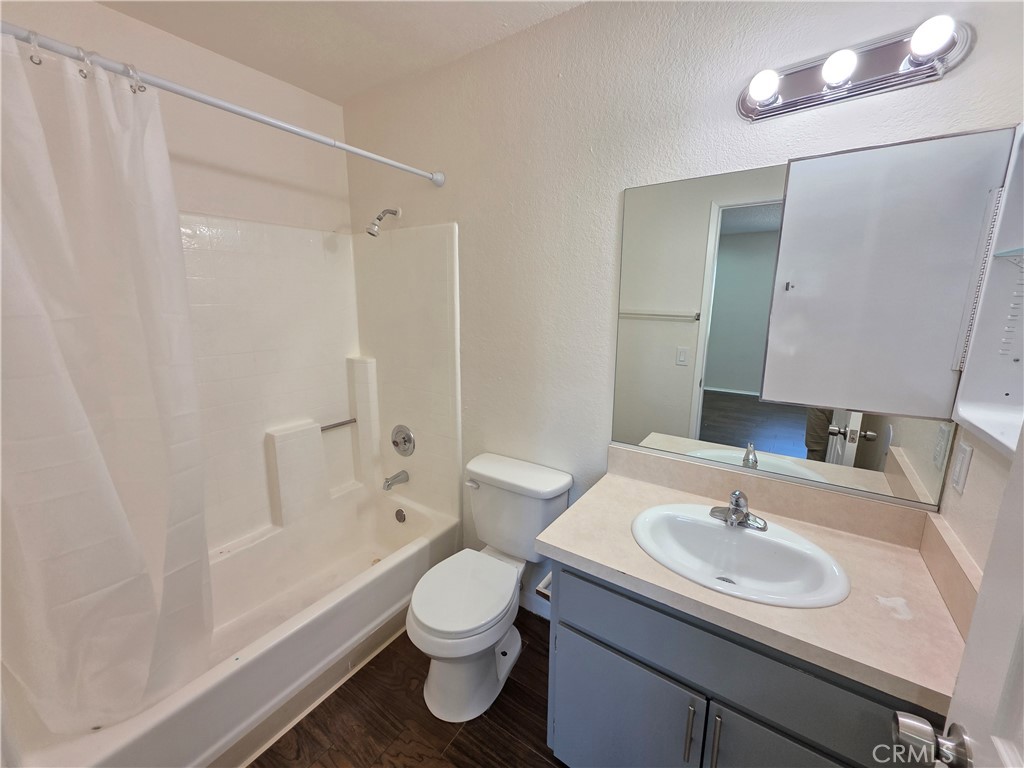 44036 25th Street West, Unit C8 Lancaster, CA 93536 - Photo 16 of 25 a bathroom with a sink toilet and shower
