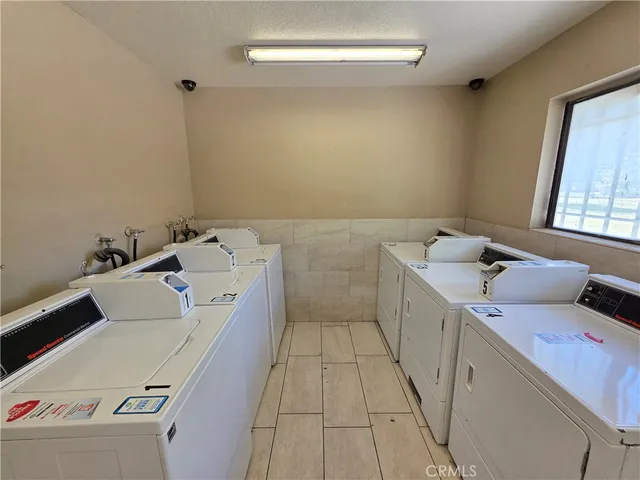 a view of a playground with basketball court