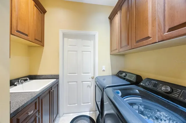 a kitchen with stainless steel appliances granite countertop a stove and refrigerator