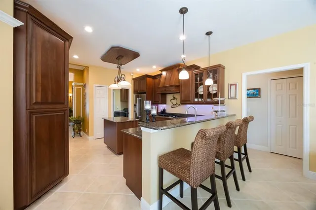 a living room with fireplace furniture and a chandelier