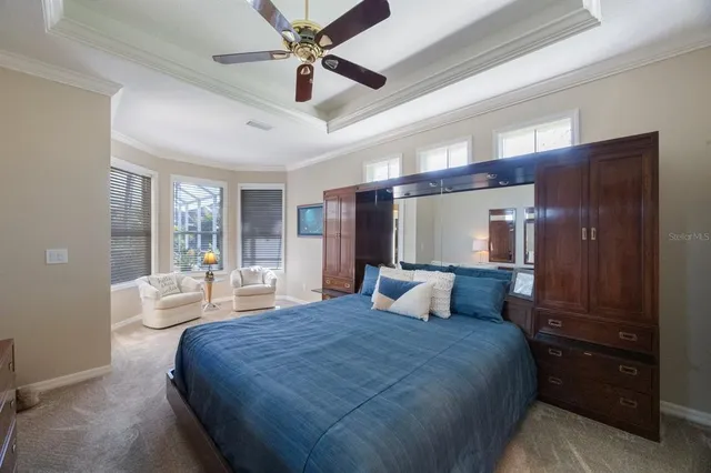 a spacious bathroom with a tub a sink and mirror