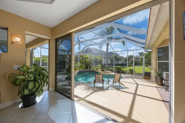 a building outdoor space with patio furniture and glass door