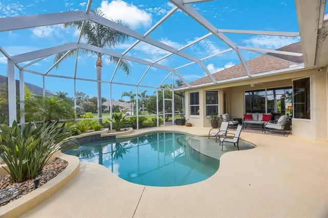 a view of a swimming pool with a patio